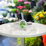 Load image into Gallery viewer, Vibrant Elegance Unleashed: Celebrate with an Oval Peridot Center in This Halo Ring
