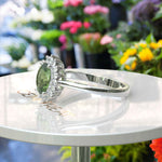 Load image into Gallery viewer, Vibrant Elegance Unleashed: Celebrate with an Oval Peridot Center in This Halo Ring
