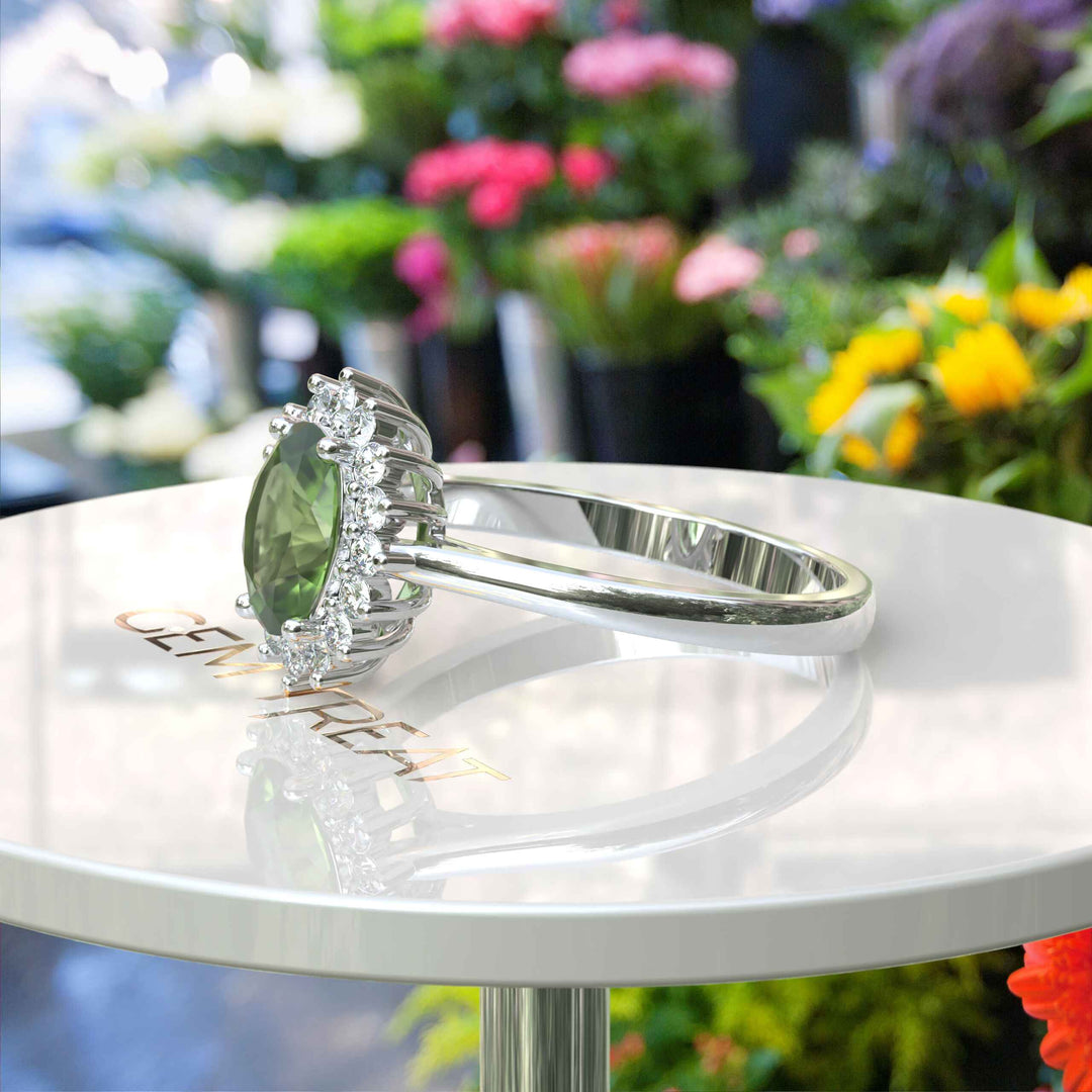 Vibrant Elegance Unleashed: Celebrate with an Oval Peridot Center in This Halo Ring