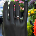 Load image into Gallery viewer, Moissanite Halo Surrounds a Brilliant Oval Red Garnet Ring
