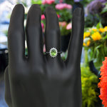 Load image into Gallery viewer, Vibrant Elegance Unleashed: Celebrate with an Oval Peridot Center in This Halo Ring
