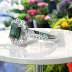 Load image into Gallery viewer, Green Majesty Meets Brilliance: Asscher Cut Green Emerald Ring, Enveloped in Moissanite Baguette Halo
