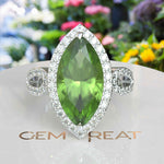 Load image into Gallery viewer, Luminous Grandeur: 8.0ct Marquise Peridot Ring with Moissanites on Halo.
