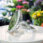 Load image into Gallery viewer, Luminous Grandeur: 8.0ct Marquise Peridot Ring with Moissanites on Halo.
