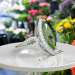 Load image into Gallery viewer, Luminous Grandeur: 8.0ct Marquise Peridot Ring with Moissanites on Halo.
