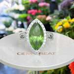 Load image into Gallery viewer, Luminous Grandeur: 8.0ct Marquise Peridot Ring with Moissanites on Halo.
