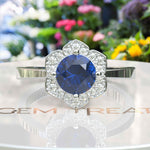 Load image into Gallery viewer, Elegant Round London Blue Topaz Ring with Moissanite Floral Halo
