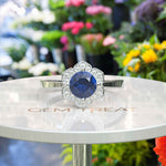 Load image into Gallery viewer, Elegant Round London Blue Topaz Ring with Moissanite Floral Halo
