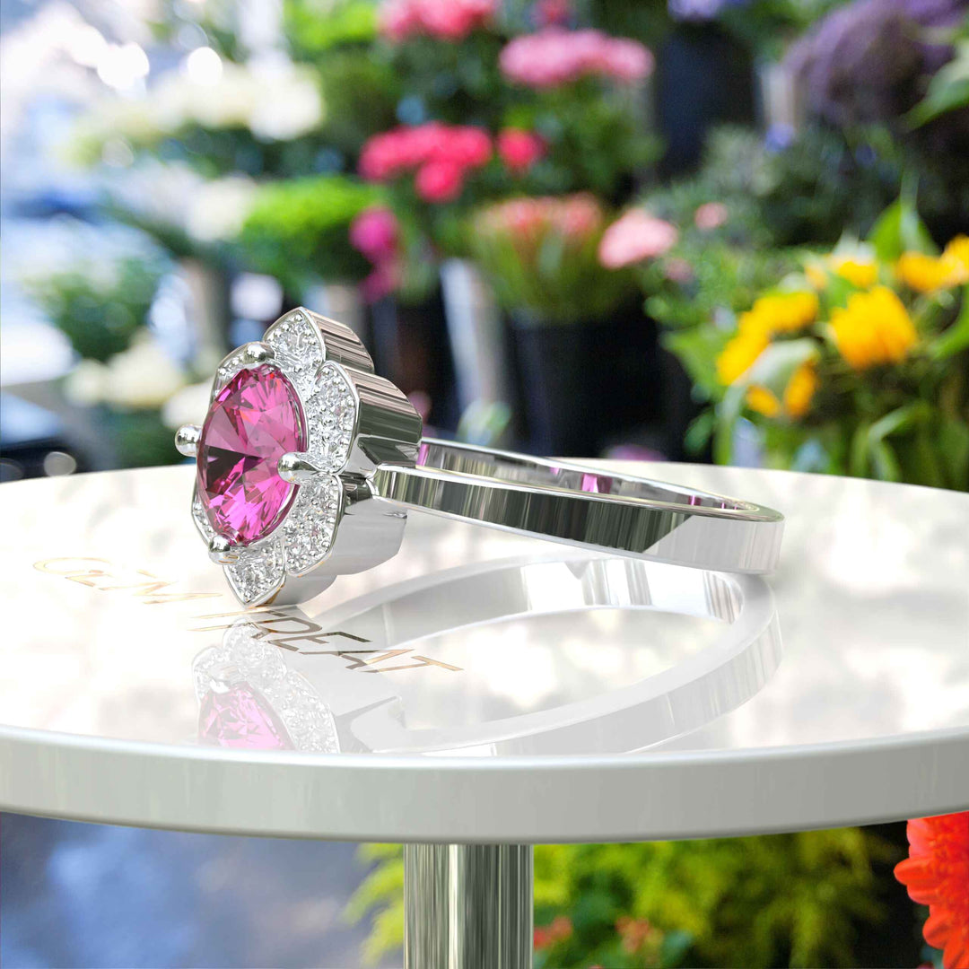 Blossoming Beauty: Round Pink Sapphire Ring in Floral Halo with Moissanite Sparkles.