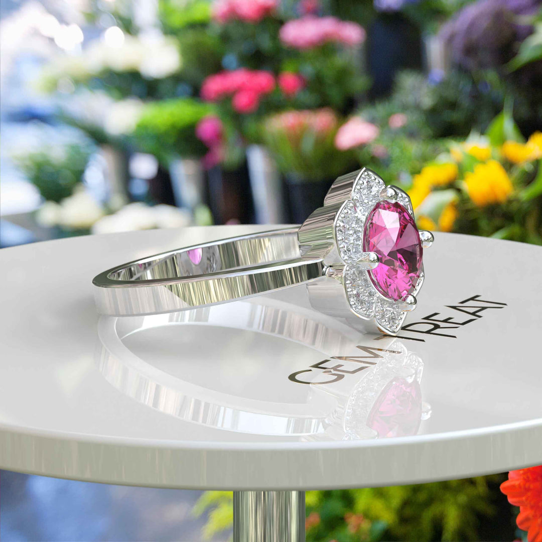 Blossoming Beauty: Round Pink Sapphire Ring in Floral Halo with Moissanite Sparkles.