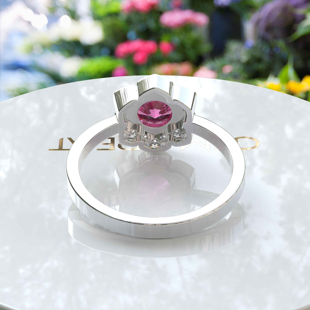 Blossoming Beauty: Round Pink Sapphire Ring in Floral Halo with Moissanite Sparkles.