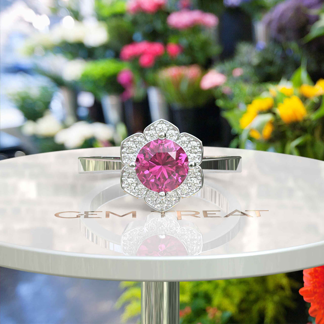 Blossoming Beauty: Round Pink Sapphire Ring in Floral Halo with Moissanite Sparkles.