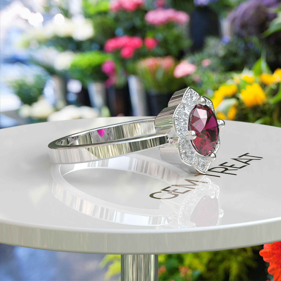 Blossoming Passion: Round Ruby Ring with Floral-Styled Halo