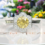 Load image into Gallery viewer, Blossoming Brilliance: Floral-Styled Round Yellow Sapphire Ring with Moissanite Halo.
