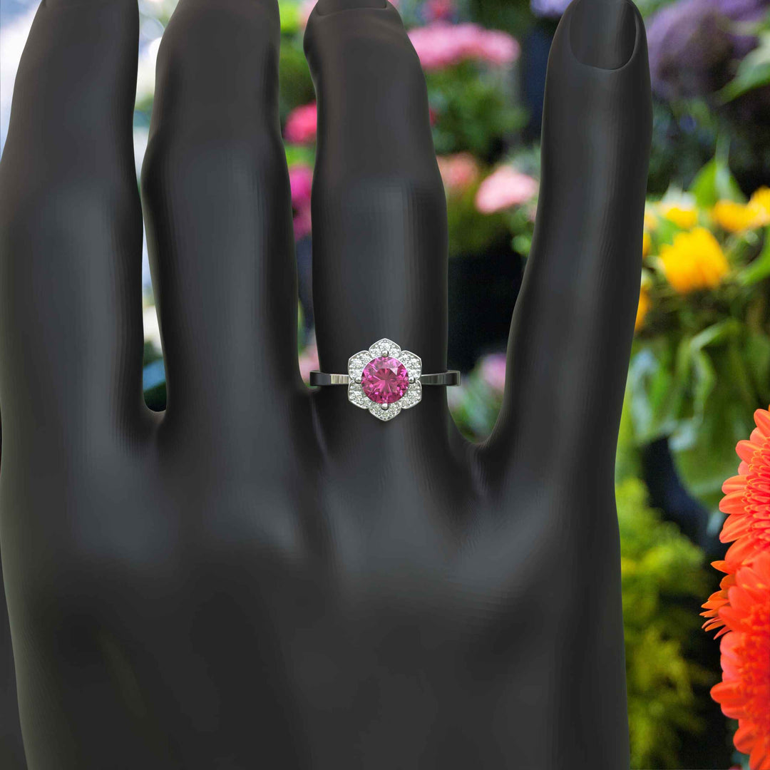 Blossoming Beauty: Round Pink Sapphire Ring in Floral Halo with Moissanite Sparkles.