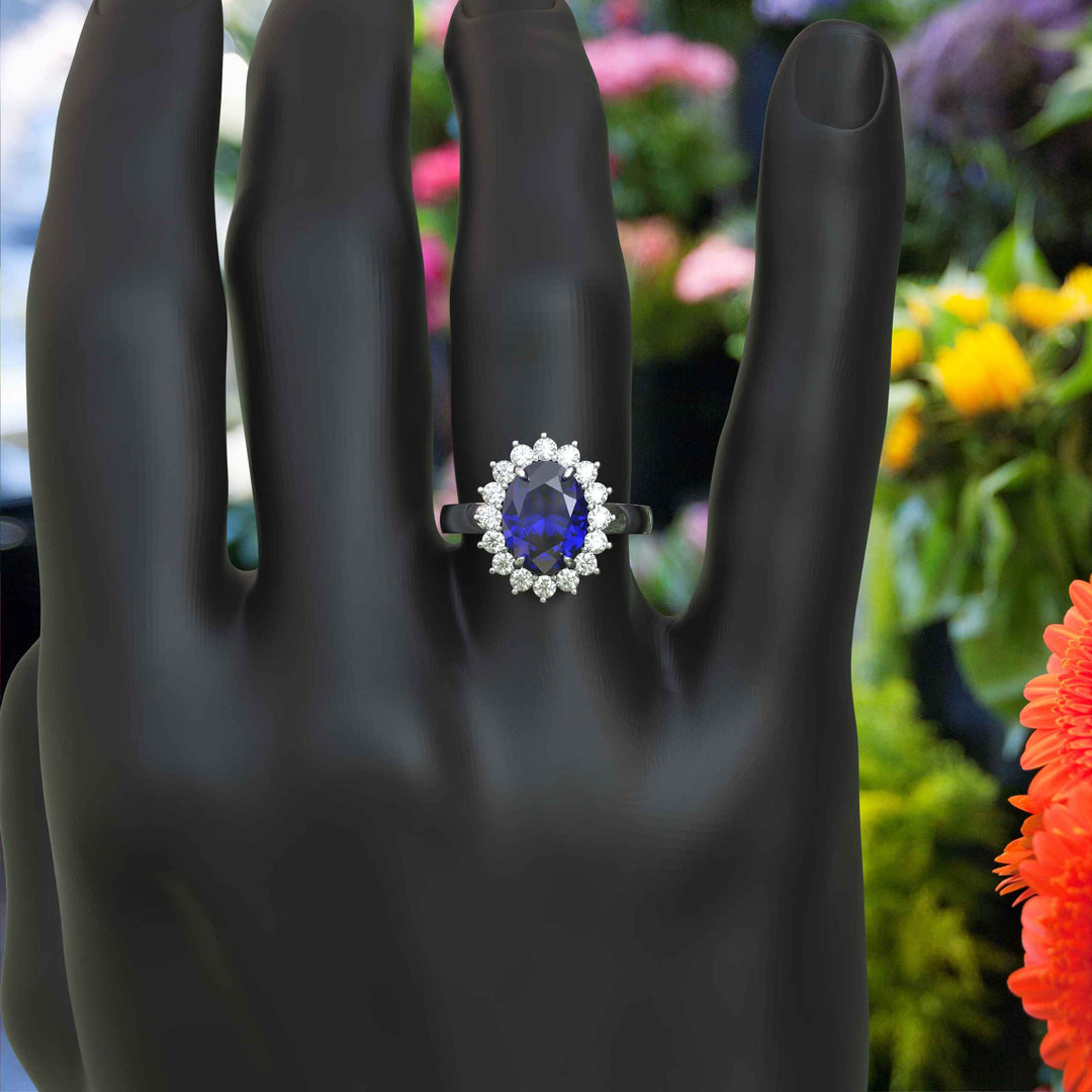 The Pinnacle of Romance: 4.0ct Oval Blue Sapphire Halo Ring Adorned with Moissanite Accents.