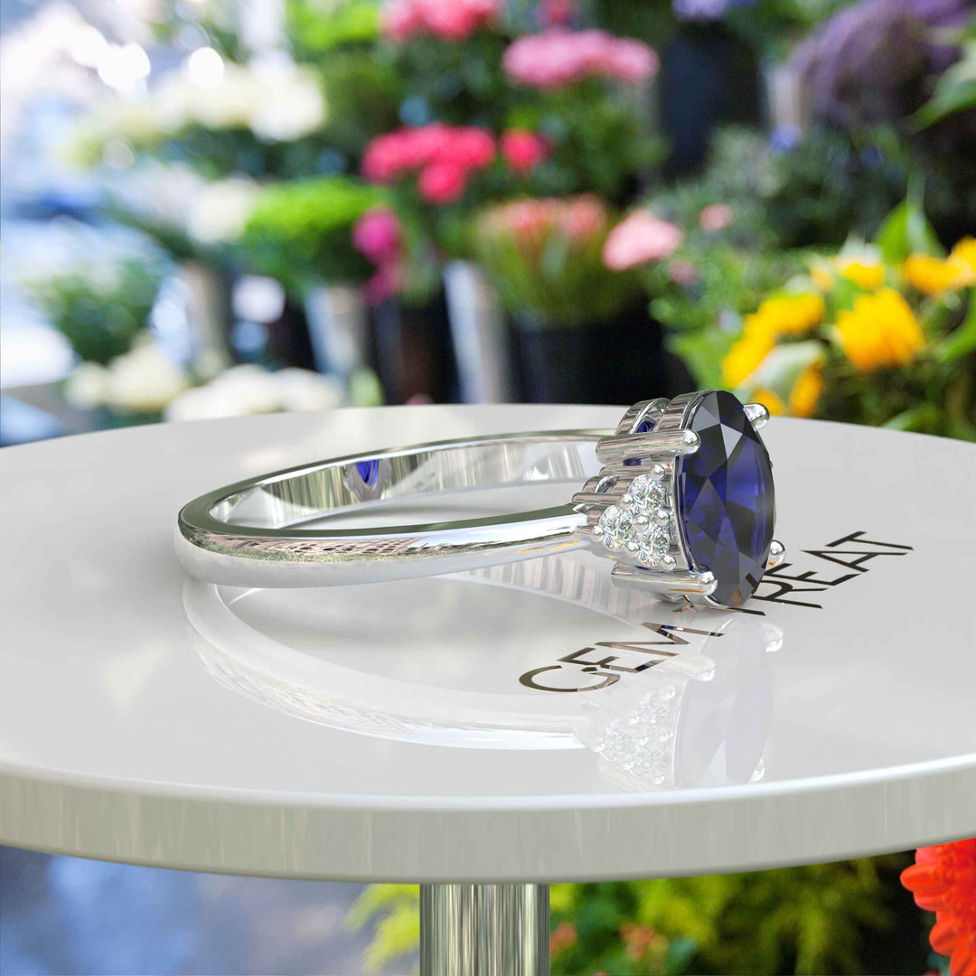 Twilight Dream: Stunning Oval Blue Sapphire Ring with Moissanite Companions.