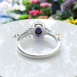 Load image into Gallery viewer, Twilight Dream: Stunning Oval Blue Sapphire Ring with Moissanite Companions.
