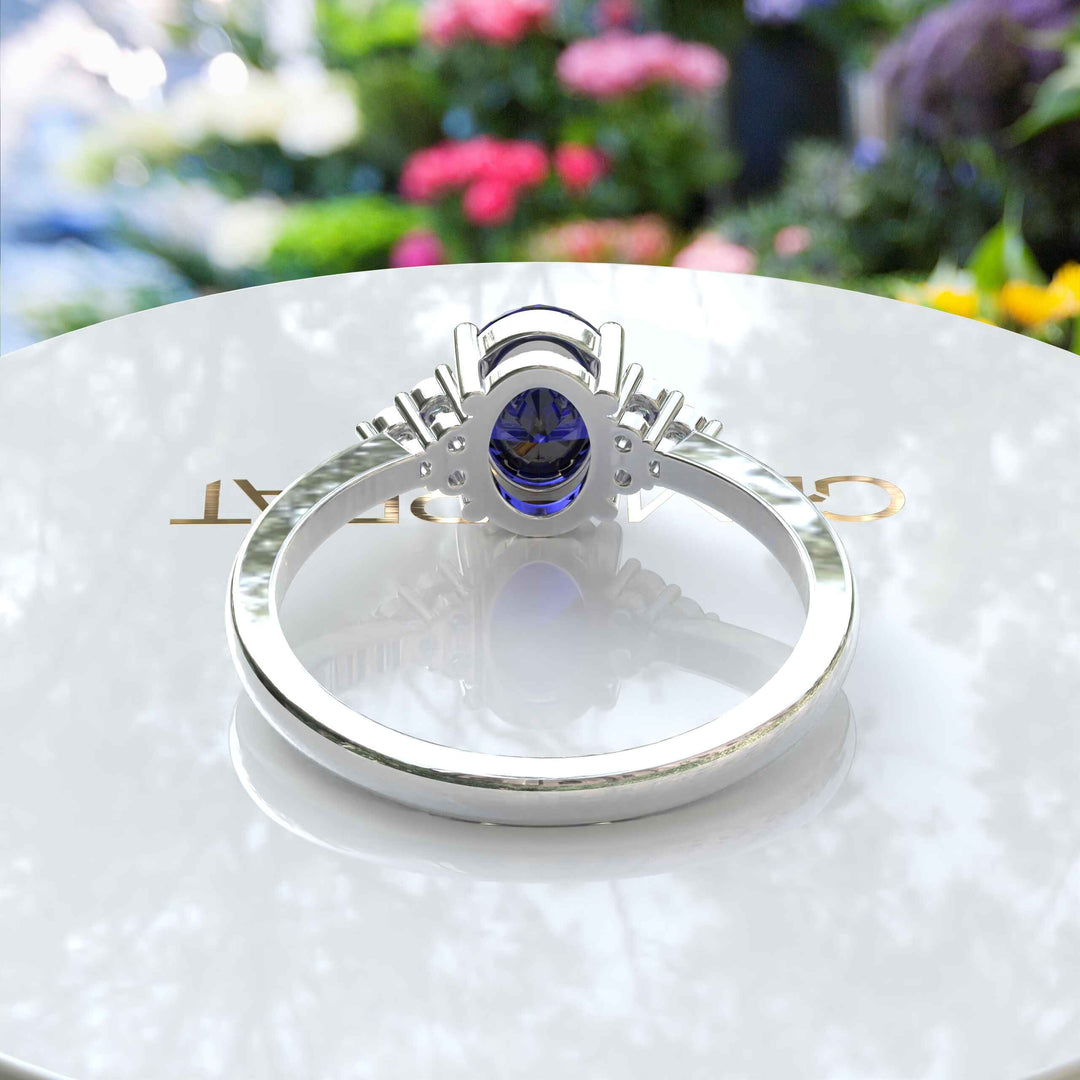 Twilight Dream: Stunning Oval Blue Sapphire Ring with Moissanite Companions.