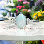 Load image into Gallery viewer, Classic Oval Opal Ring with Lustrous Moissanite Side Stones
