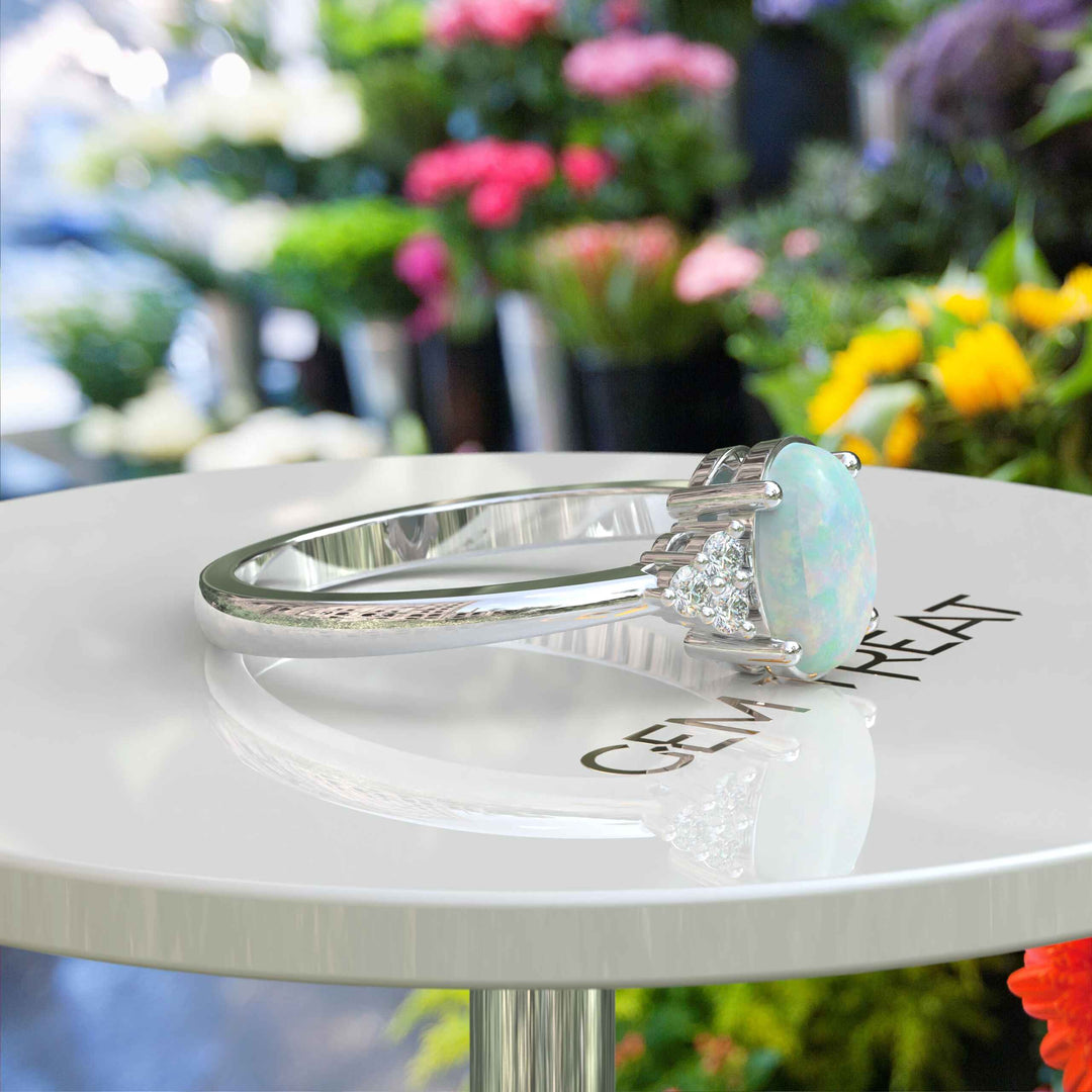 Classic Oval Opal Ring with Lustrous Moissanite Side Stones