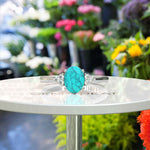 Load image into Gallery viewer, Mesmeric Blue: Oval Turquoise Ring with Brilliant Moissanite Companions.
