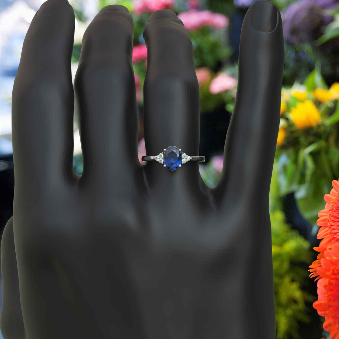 Captivating Oval London Blue Topaz and Moissanite Accent Gemstone Ring