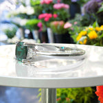 Load image into Gallery viewer, Garden of Radiance: Deep Green Cushion-Cut Emerald with Dazzling Moissanite Edges.
