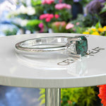 Load image into Gallery viewer, Garden of Radiance: Deep Green Cushion-Cut Emerald with Dazzling Moissanite Edges.
