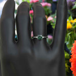 Load image into Gallery viewer, Garden of Radiance: Deep Green Cushion-Cut Emerald with Dazzling Moissanite Edges.
